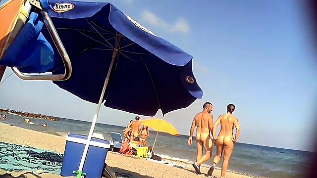 Nudist beach voyeur shoots a sexy mature lady with big boobs