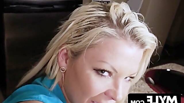 A promiscuous blonde mother seductively takes the muscular mans large penis into her mouth, performing oral sex.