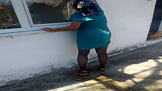 Sexy cleaner who wipes glass wants to arouse